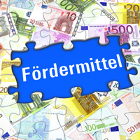 Puzzleteile mit Geldscheinen und das Wort "Fördermittel"