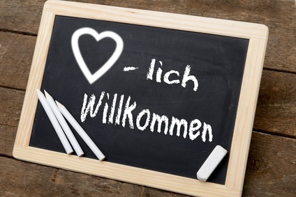 Tafel mit Kreide geschrieben "Herzlich willkommen"